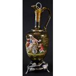 A German Secessionist pewter-mounted enamelled green glass claret jug, painted in polychrome