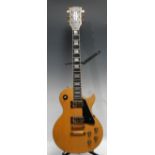 A Gibson Les Paul Custom electric guitar, natural finish. mahagony body, maple top and neck, ebony