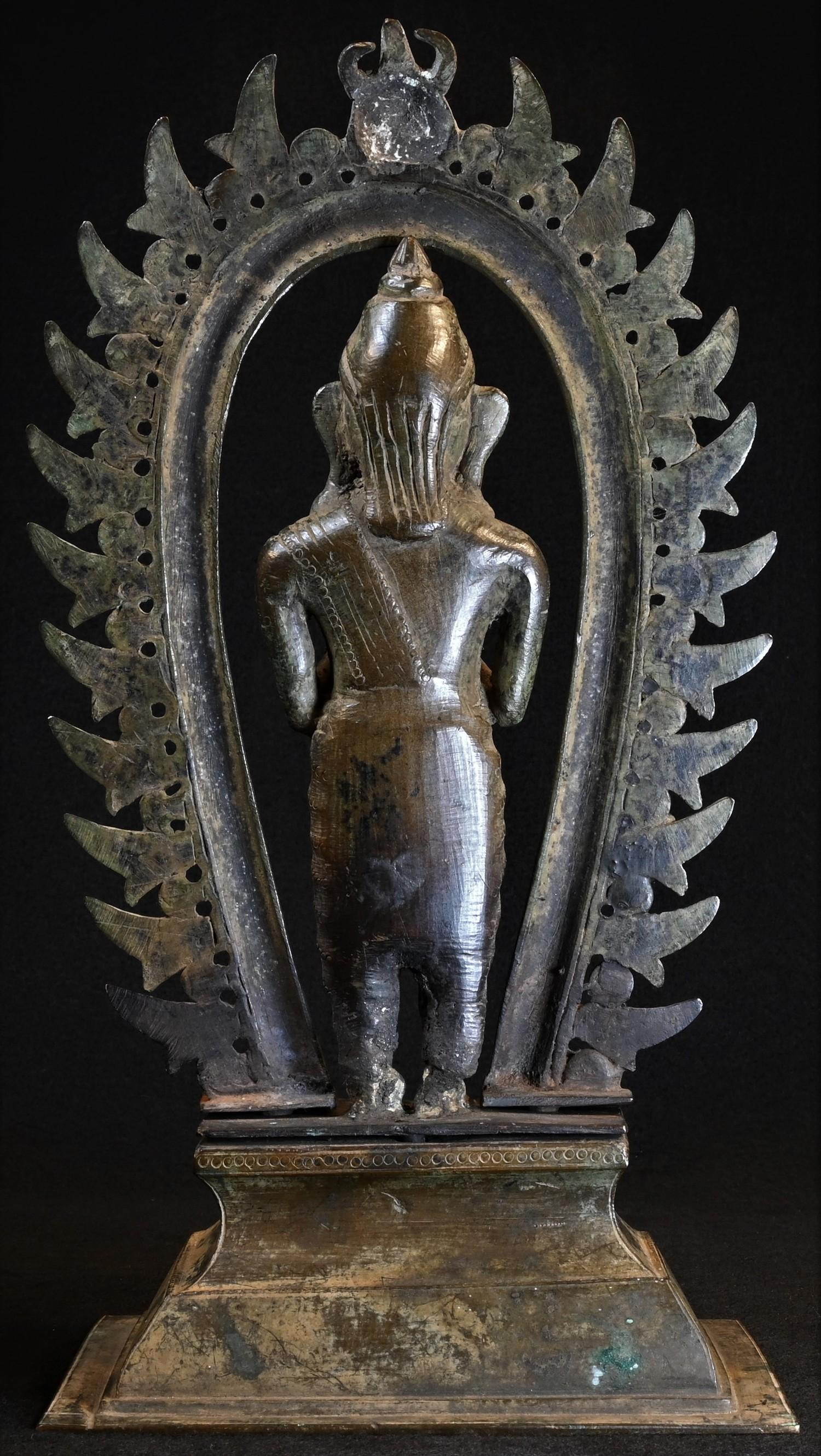 A 19th century Indian shrine figure, cast as a deity, standing, beneath a nimbus, rectangular - Image 4 of 4