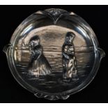 A WMF shaped circular dish, the field in relief with Dutch children by the Zuiderzee in