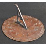 A Victorian bronze sundial, engraved with sunburst, points of the compass and Roman numerals, the