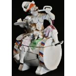 A late 19th century German porcelain novelty tobacco jar, as musician jester and his dog, seated