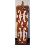 Tribal Art - an Asmat wooden shield, carved and painted in black, white and earth pigments with