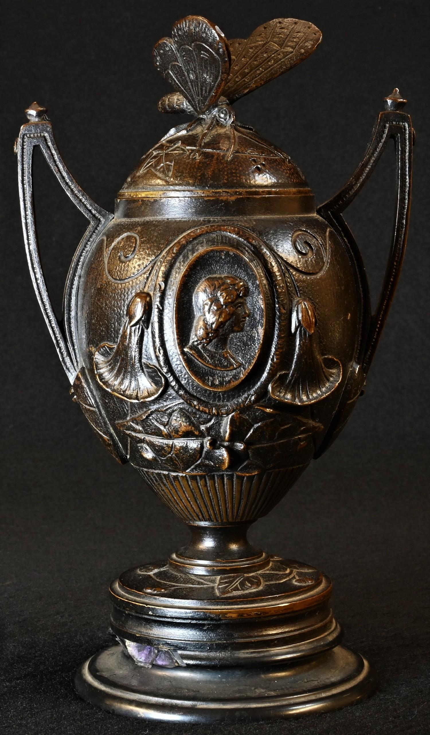 A 19th century brown patinated bronze, cast with portrait ovals, butterfly finial, belge noir - Image 2 of 4