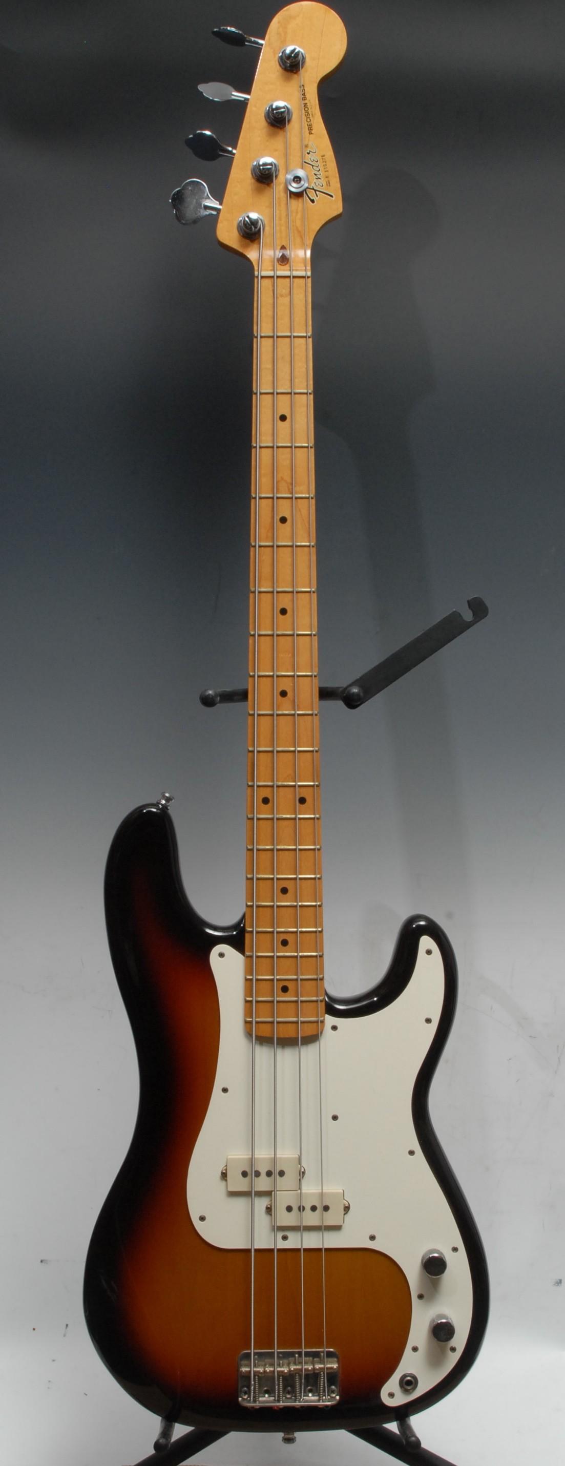 A Fender Precision electric bass guitar USA, tobacco sunburst, cream scratch plate and pick up,