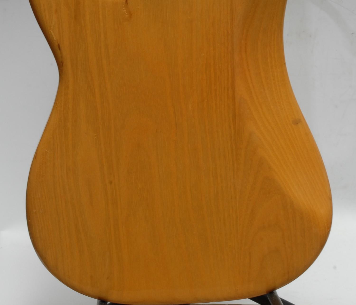 A Fender Precision electric bass guitar USA, natural wood body, maple neck, black pickguard. - Image 13 of 16