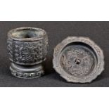 A Chinese dark patinated bronze brush washer, cast with scrolls on a ground of trellis, 5.5cm