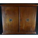 An early 20th century mahogany coin collector's table cabinet, slightly oversailing rectangular