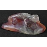 An amethyst quartz desk weight, carved as a lizard, 10cm wide