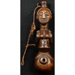 Tribal Art - a Luba or Baluba figural pipe, carved with a naked woman straddling a sphere, 21cm