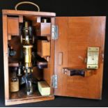 A lacquered and black painted brass monocular microscope, by E Leitz, Wetzlar, No.63710, rack-and-
