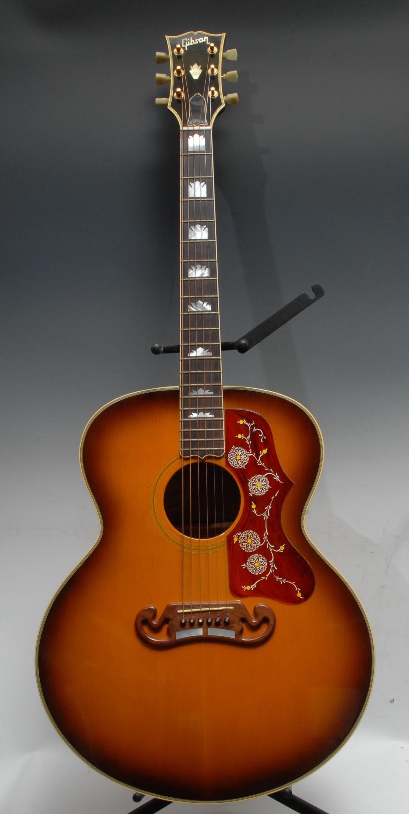 A Gibson J200 acoustic guitar, USA, natural tobacco sunburst finish, gold hardwear. Serial number