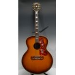 A Gibson J200 acoustic guitar, USA, natural tobacco sunburst finish, gold hardwear. Serial number