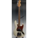 A Fender Jazz electric bass guitar, made in Korea, serial no. E1047713, Olympic White gloss finish