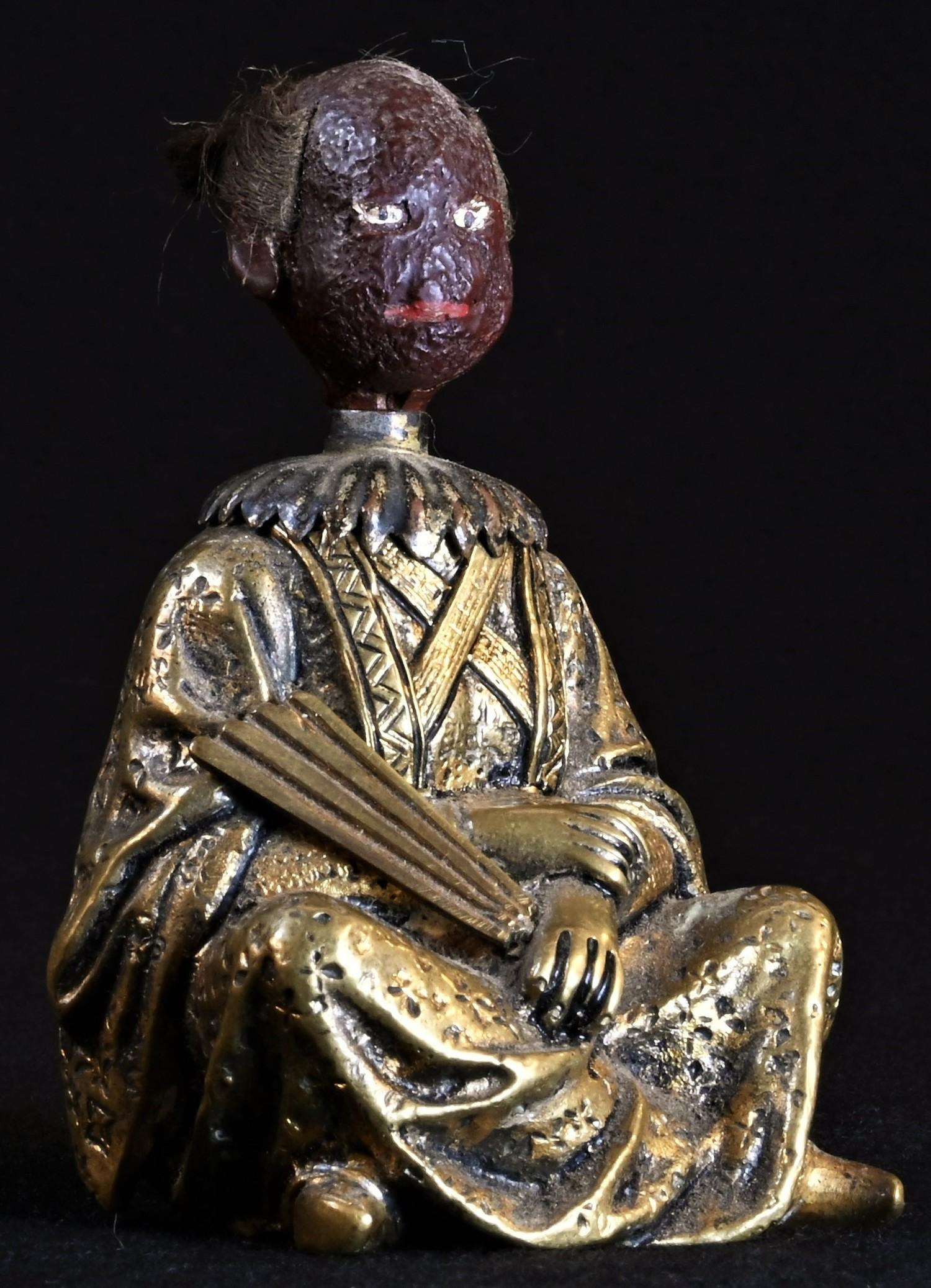 A 19th century Chinoiserie gilt bronze and composition novelty glue pot, cast as a Chinese man,