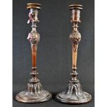 A pair of 19th century mahogany table candlesticks, half-fluted campana sconces, inverted baluster