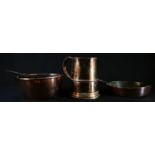 A George III copper saucepan with rolled edge and steel handle, 37cm over handle; a 19th century