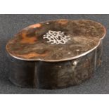 A George V silver mounted tortoiseshell shaped table casket, hinged cover, 12.5cm wide, the fittings