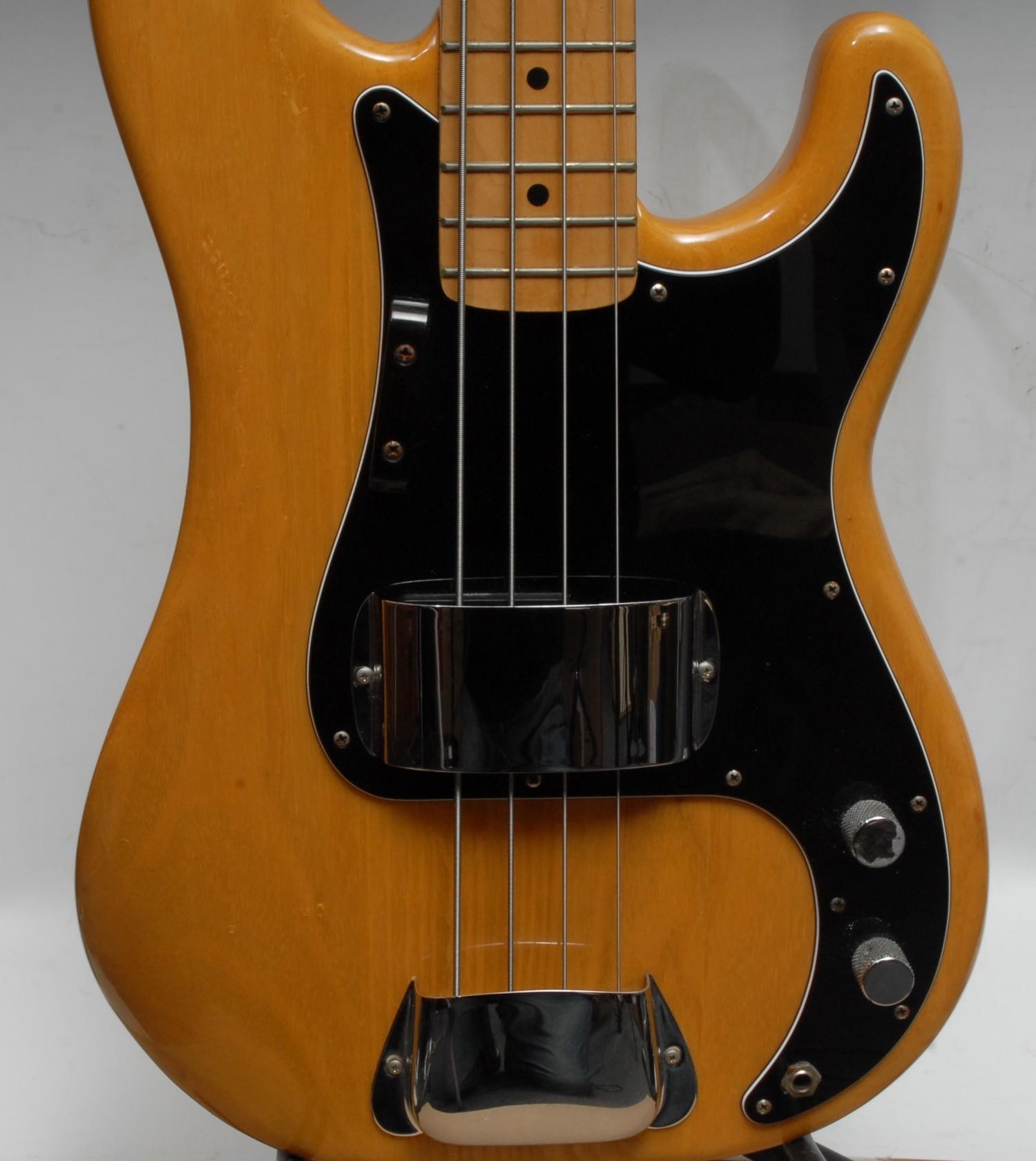 A Fender Precision electric bass guitar USA, natural wood body, maple neck, black pickguard. - Image 5 of 16