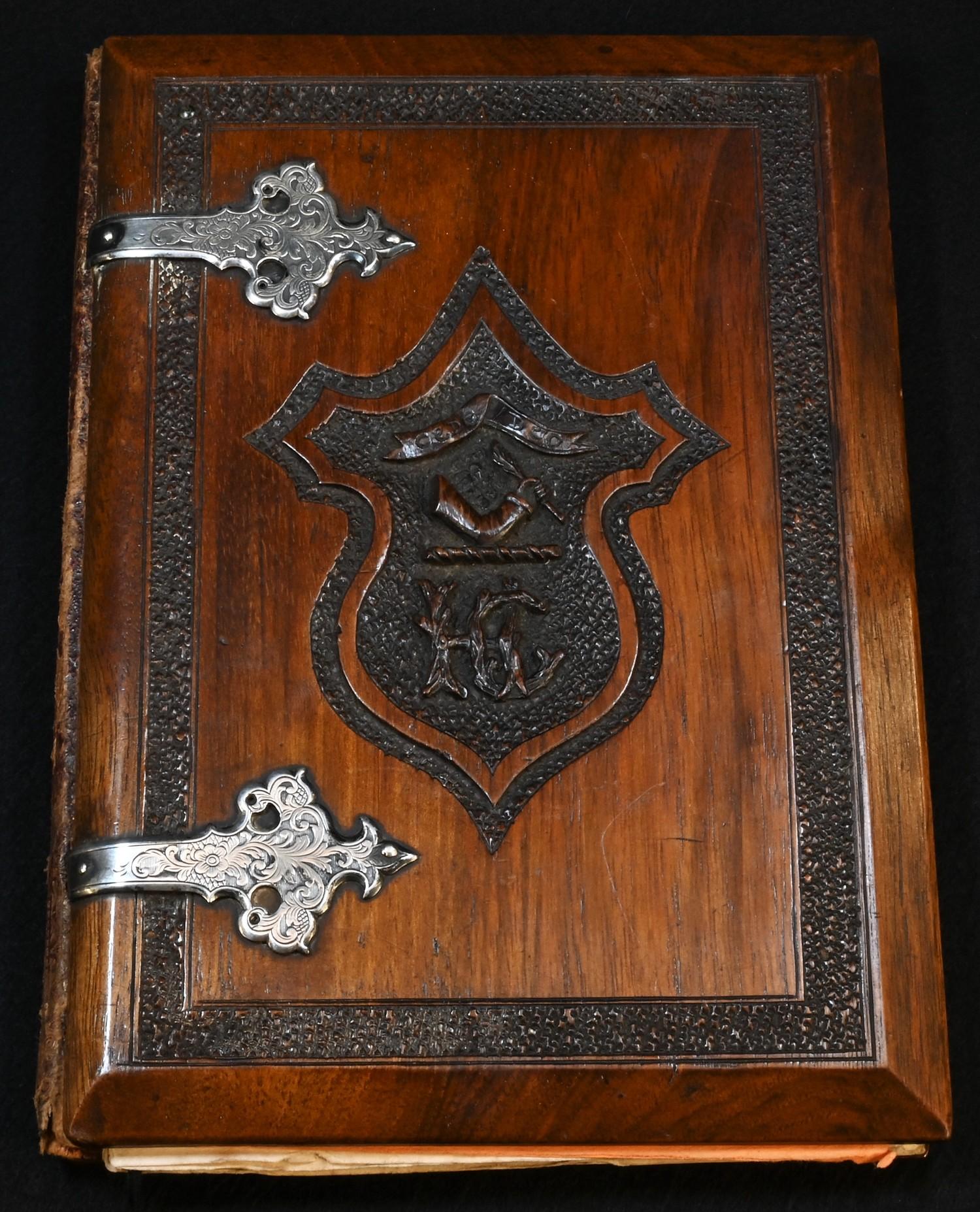 A 19th century Anglo-Indian silver coloured metal mounted hardwood blotter or album, carved to recto