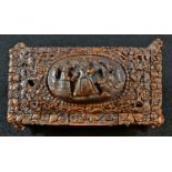 An early 19th century coquilla nut casket, hinged cover with an oval panel carved in relief with