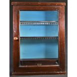 An early 20th century mahogany apothecary or chemist?s shop fitting wall hanging pharmaceutical
