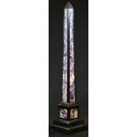 A Grand Tour style amethyst quartz and black marble library desk obelisk, stepped base, 40.5cm high