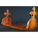 A George/William IV Gothic Revival yew book stand, hinged trefoil end supports, 38cm long, c.1830