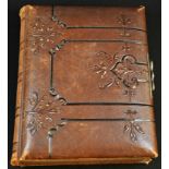 Photography - a 19th century tooled morocco leather album of photographs and carte de visites,
