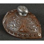 A 19th century Colonial coconut shell, finely carved with musical trophies, 12.5cm wide