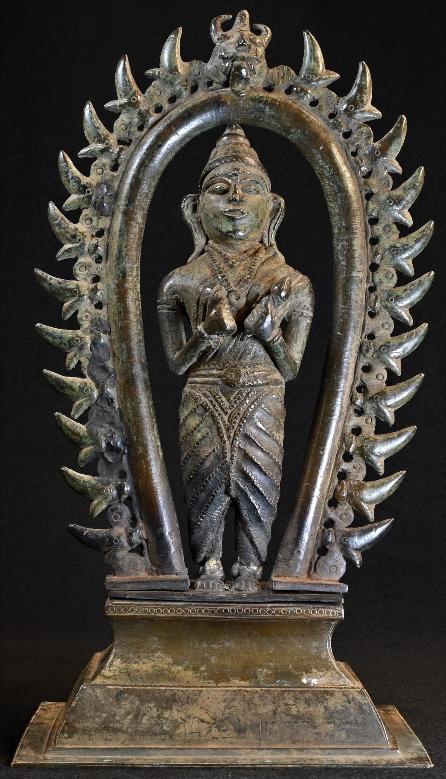 A 19th century Indian shrine figure, cast as a deity, standing, beneath a nimbus, rectangular - Image 2 of 4