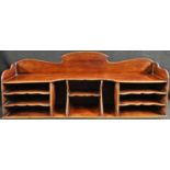 A late Victorian/Edwardian mahogany estate office correspondence rack, shaped three-quarter