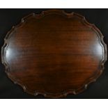 A George III design mahogany shaped oval tray, pie crust border, 61cm wide