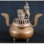 A Japanese gilt bronze koro, domed cover with cast temple lion finial, S-shaped lug handles, lion