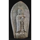 A Chinese limestone shrine figure, carved as Buddha cradling an infant, within a lotus, 46cm high,