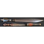 A Somali billao dagger or short sword, 35.5cm blade, horn hilt, 54cm long; another African dagger (