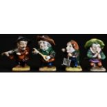 A set of four Continental porcelain novelty figures, as a band of Itinerant Dwarf Musicians, each