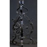 A Baroque style wrought iron tripod table lamp, trefoil neck, scroll frame and feet, 25.5cm high