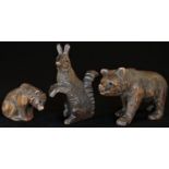 A Black Forest cabinet carving, of a squirrel, 8cm high, c.1900; another, of a bear, on all fours,