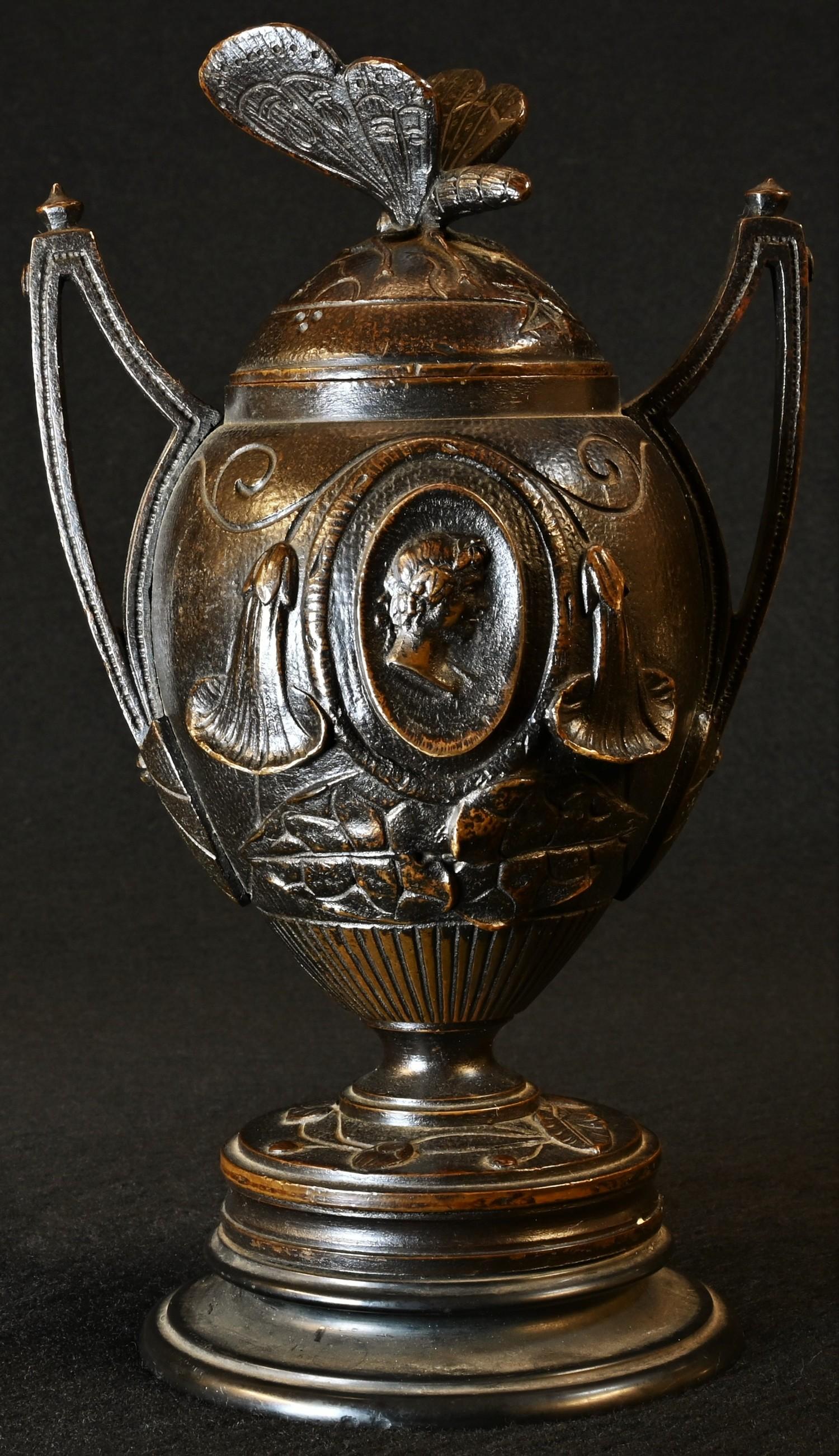 A 19th century brown patinated bronze, cast with portrait ovals, butterfly finial, belge noir - Image 3 of 4