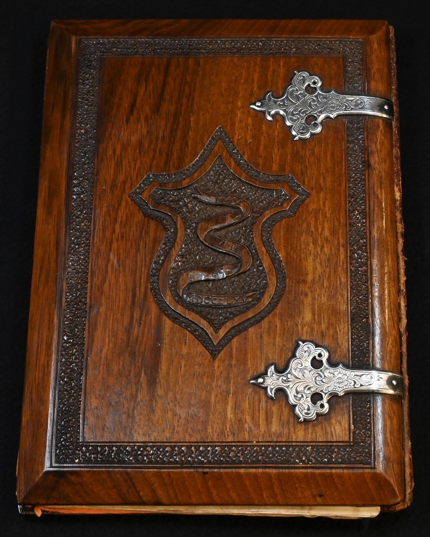 A 19th century Anglo-Indian silver coloured metal mounted hardwood blotter or album, carved to recto - Image 4 of 6