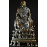 Chinese School (19th century), a brown patinated bronze, of an immortal, seated, wearing a rank