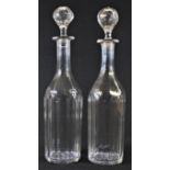 A pair of Victorian slice-cut clear glass slender mallet shaped decanters, star-cut bases, 33.5cm