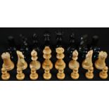 A Staunton pattern boxwood and ebonised weighted chess set, the pieces marked for King's side, the