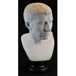 A Grand Tour type plaster library bust, of a Roman gentleman, ebonised plinth, 49cm high