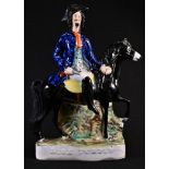 The Cult of the Highwayman - a 19th century Staffordshire figure, Dick Turpin, finely dressed and