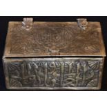 A Middle Eastern brass rectangular box, chased in the Islamic taste with Arabic calligraphy, a