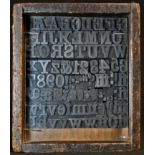 Typography - a cased set of early 20th century cast type, the 84 pieces including the upper-case