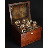 A George III mahogany rectangular apothecary box, hinged cover enclosing an arrangement of chemist's