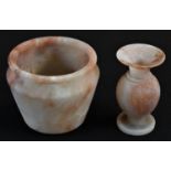 A turned alabaster vessel, 9cm high; an alabster vase, 9.5cm high